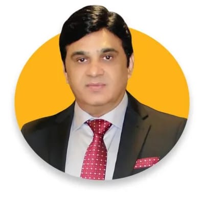 Zaman Chaudhary, Chief Executive Officer of Global Dairy Tech, in a dark suit and red tie